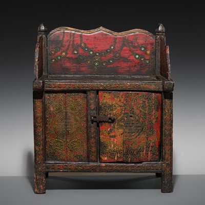 Lot 187 - A POLYCHROME WOOD ‘SHOU’ PRAYER CABINET, TIBET, 19TH CENTURY