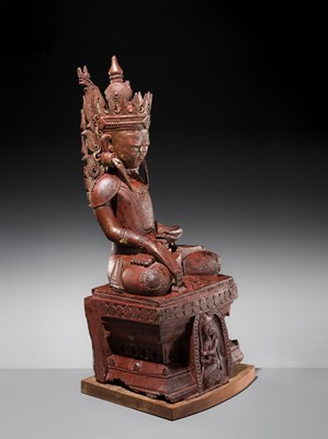 Lot 17 - A LARGE LACQUERED WOOD FIGURE OF JAMBUPATI BUDDHA, SHAN STATES