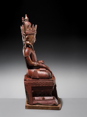 Lot 17 - A LARGE LACQUERED WOOD FIGURE OF JAMBUPATI BUDDHA, SHAN STATES
