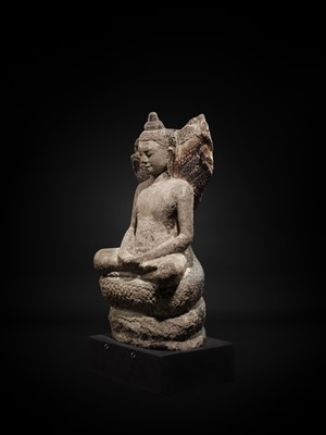 Lot 24 - A RARE SANDSTONE FIGURE OF BUDDHA MUCHALINDA, LOPBURI STYLE, 13TH CENTURY