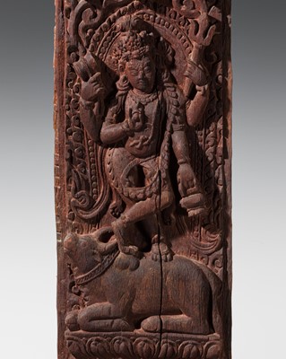 Lot 119 - A WOOD STRUT DEPICTING THE FOUR-ARMED BHAIRAVA, VIGRAHA, NEPAL, CIRCA 18TH CENTURY