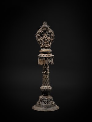Lot 113 - A LARGE BRONZE TEMPLE LAMP DEPICTING SURYA ATOP HIS CHARIOT, NEPAL, 18TH CENTURY