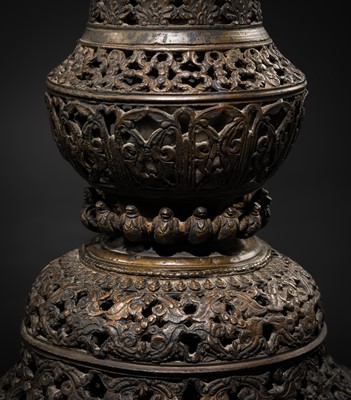 Lot 113 - A LARGE BRONZE TEMPLE LAMP DEPICTING SURYA ATOP HIS CHARIOT, NEPAL, 18TH CENTURY