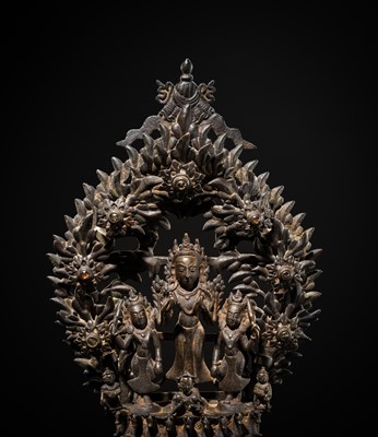 Lot 113 - A LARGE BRONZE TEMPLE LAMP DEPICTING SURYA ATOP HIS CHARIOT, NEPAL, 18TH CENTURY