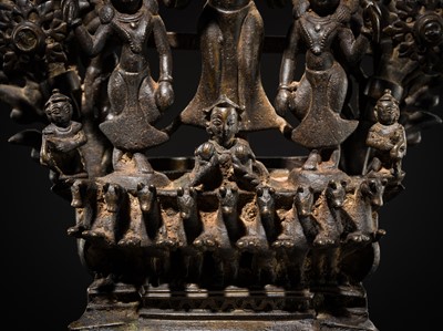 Lot 113 - A LARGE BRONZE TEMPLE LAMP DEPICTING SURYA ATOP HIS CHARIOT, NEPAL, 18TH CENTURY