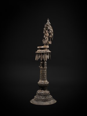 Lot 113 - A LARGE BRONZE TEMPLE LAMP DEPICTING SURYA ATOP HIS CHARIOT, NEPAL, 18TH CENTURY