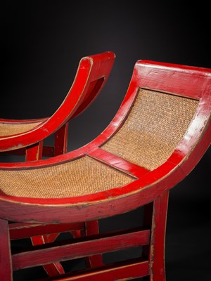 Lot 155 - A PAIR OF RED-LACQUERED WOOD AND RATTAN KARTINI STOOLS