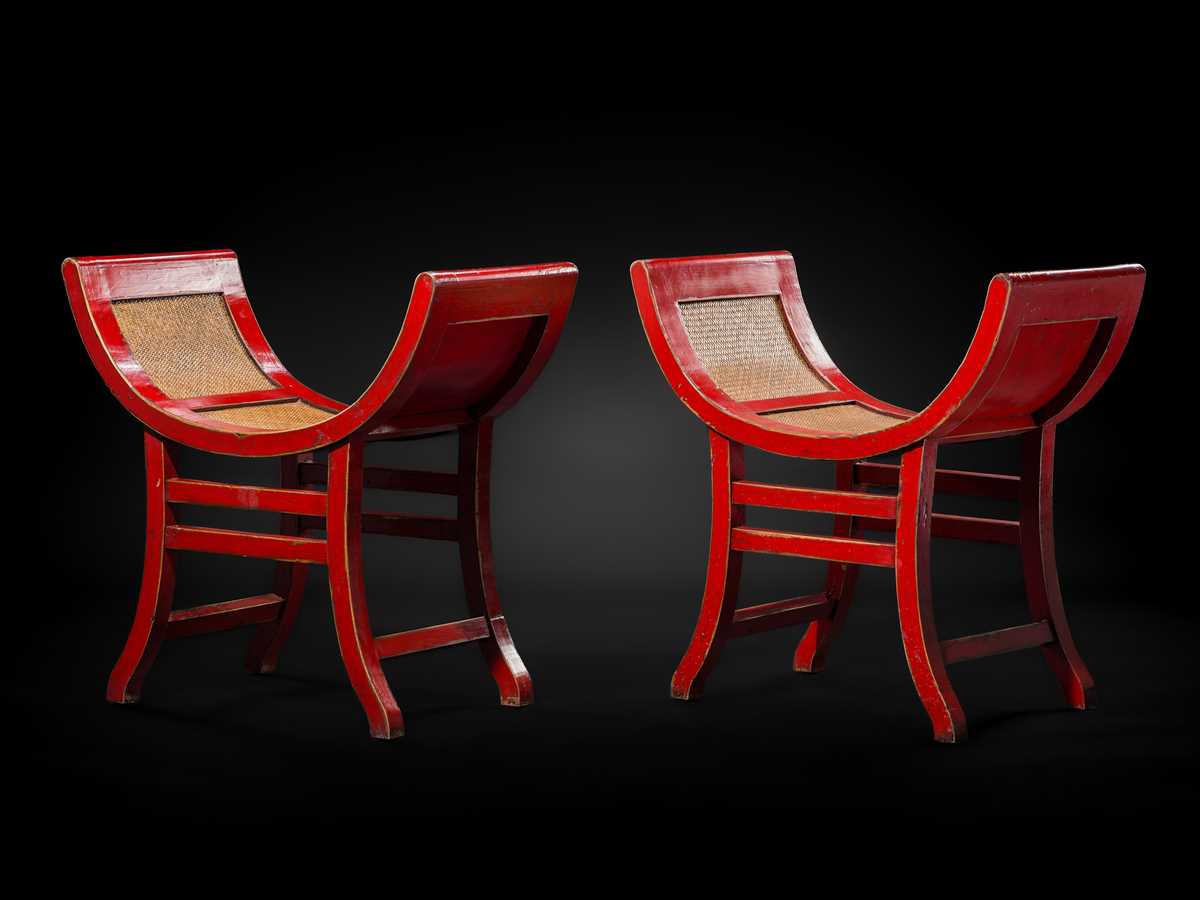 Lot 155 - A PAIR OF RED-LACQUERED WOOD AND RATTAN KARTINI STOOLS