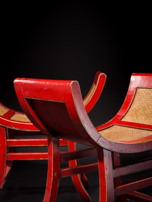 Lot 155 - A PAIR OF RED-LACQUERED WOOD AND RATTAN KARTINI STOOLS