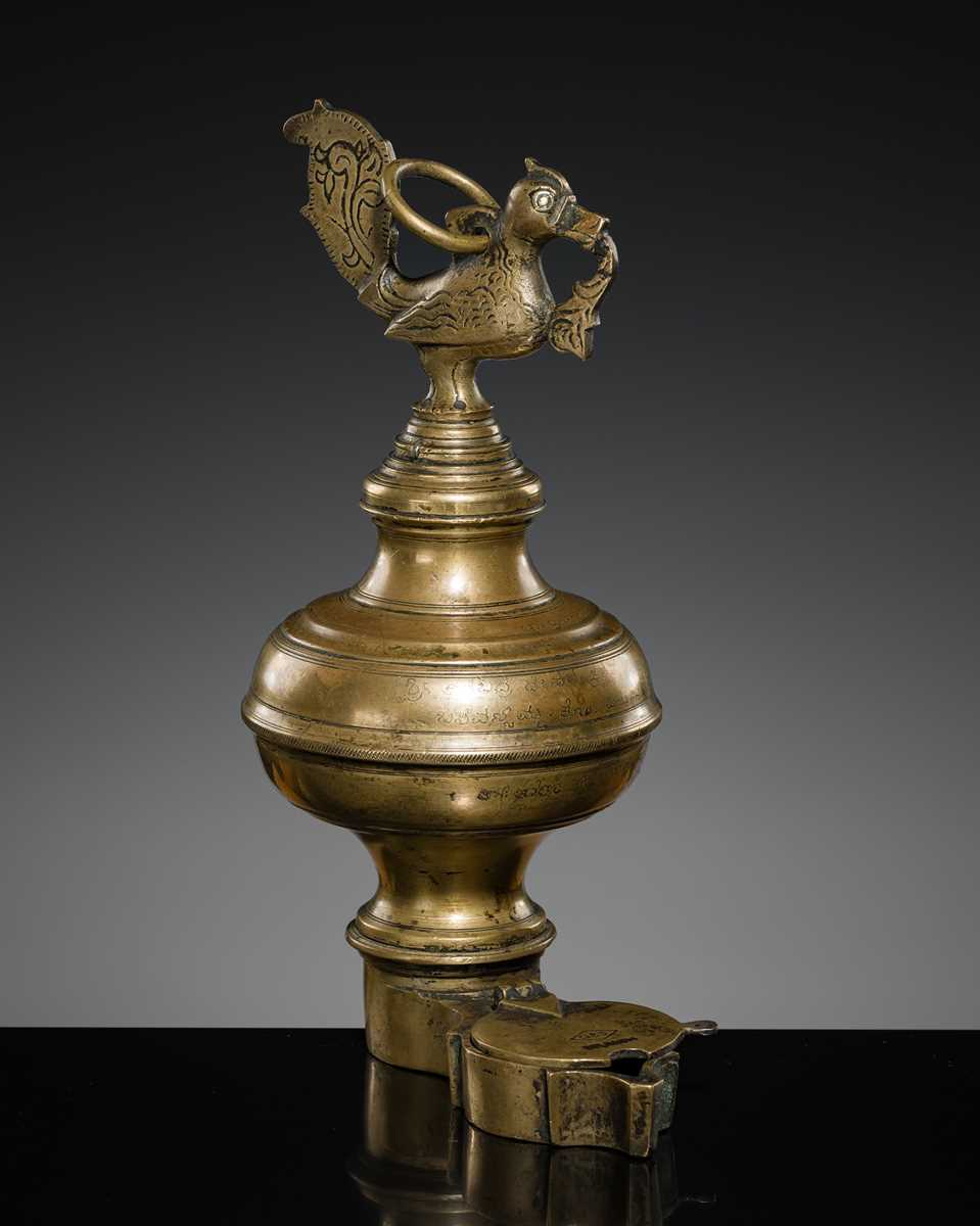 Lot 186 - A BRASS ‘PEACOCK’ OIL LAMP, KEDA VILAKKU, KERALA, 19TH-EARLY 20TH CENTURY