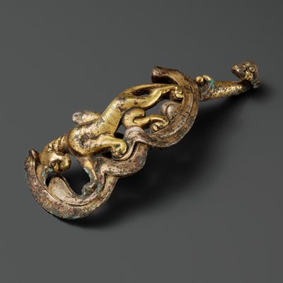 Lot 792 - A GILT-BRONZE ‘TIGER’ BELT HOOK, QING DYNASTY OR EARLIER