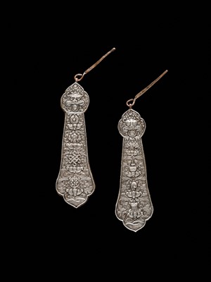 Lot 24 - A PAIR OF SILVER REPOUSSÉ FITTINGS, TIBET, 19TH CENTURY