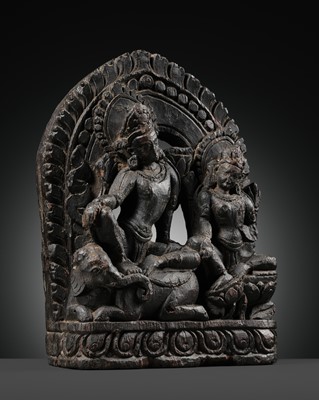 Lot 76 - A LACQUERED WOOD STELE OF SHIVA AND PARVATI, 17TH CENTURY