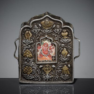 Lot 220 - A PARCEL-GILT SILVER REPOUSSÉ GAU WITH HAYAGRIVA, TIBET, 19th CENTURY