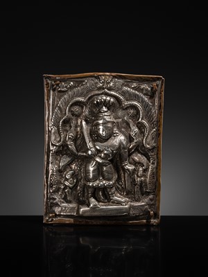 Lot 107 - A COPPER CEREMONIAL SHIELD WITH SILVER REPOUSSÉ PLAQUE DEPICTING VIRABHADRA, INDIA, 19TH CENTURY