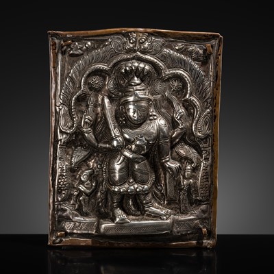 Lot 107 - A COPPER CEREMONIAL SHIELD WITH SILVER REPOUSSÉ PLAQUE DEPICTING VIRABHADRA, INDIA, 19TH CENTURY