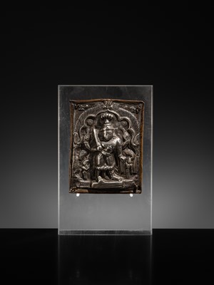 Lot 107 - A COPPER CEREMONIAL SHIELD WITH SILVER REPOUSSÉ PLAQUE DEPICTING VIRABHADRA, INDIA, 19TH CENTURY