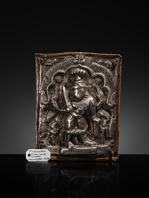 Lot 107 - A COPPER CEREMONIAL SHIELD WITH SILVER REPOUSSÉ PLAQUE DEPICTING VIRABHADRA, INDIA, 19TH CENTURY