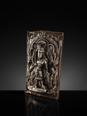 Lot 107 - A COPPER CEREMONIAL SHIELD WITH SILVER REPOUSSÉ PLAQUE DEPICTING VIRABHADRA, INDIA, 19TH CENTURY