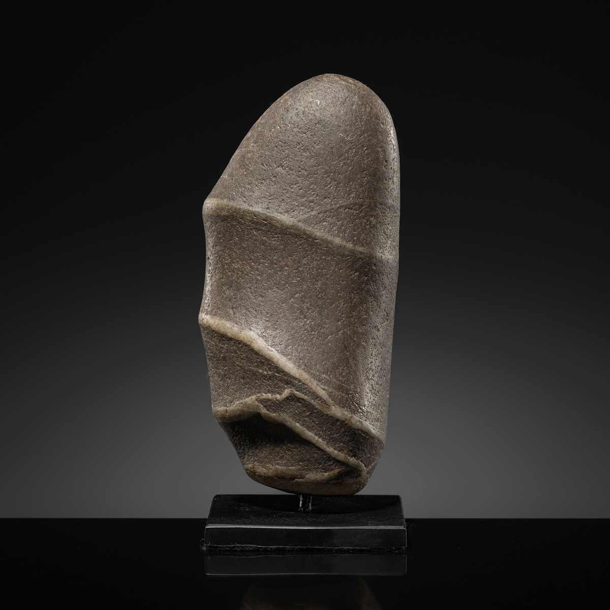 Exploding Phallic Devices Lot 9 - A PHALLIC STONE LINGAM, HIMALAYAN REGIONS,