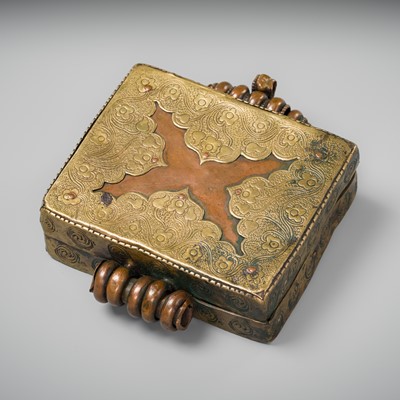 Lot 225 - A COPPER AND BRASS AMULET BOX AND COVER, GAU