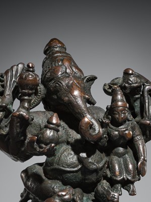 Lot 74 - A BRONZE GROUP OF GANESHA AND SHAKTI, VIJAYANAGAR EMPIRE, 16TH CENTURY