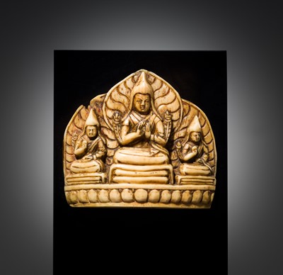 Lot 123 - AN IVORY PLAQUE OF TSONGKHAPA WITH KEDRUP AND GYELTSAP