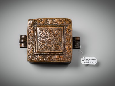 Lot 48 - A COPPER REPOUSSÉ AMULET BOX AND COVER, GAU, WITH SUTRA ROLLS AND RITUAL OBJECTS, 18TH-19TH CENTURY