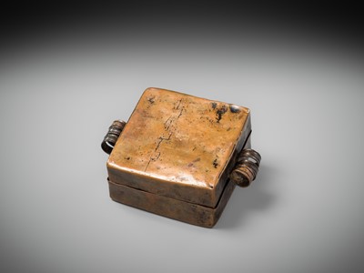 Lot 48 - A COPPER REPOUSSÉ AMULET BOX AND COVER, GAU, WITH SUTRA ROLLS AND RITUAL OBJECTS, 18TH-19TH CENTURY