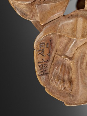 Lot 193 - NORISHIGE: A WOOD NETSUKE OF AN ONI GETTING HIS EAR CLEANED BY A BIJIN