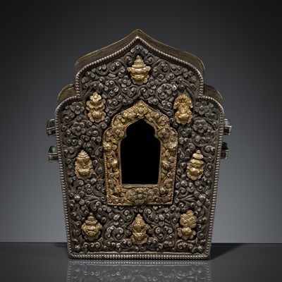 Lot 218 - A SILVER AND GILT-COPPER REPOUSSÉ SHRINE, GAU, TIBET, 18TH-19TH CENTURY