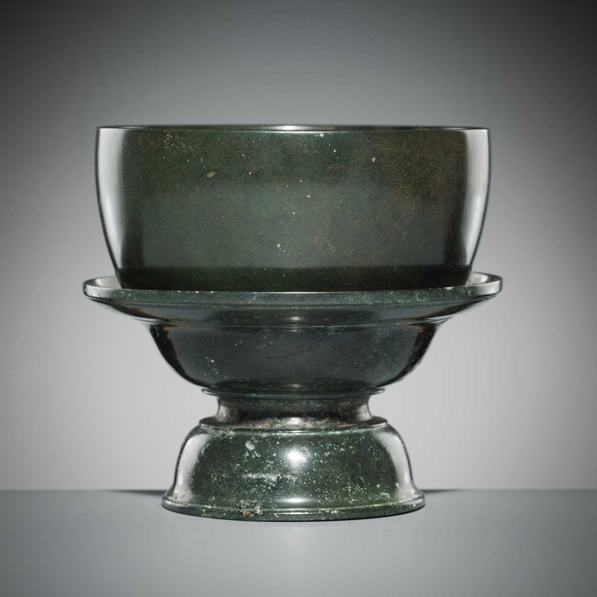 Lot 143 - A KHMER BRONZE BOWL AND STAND, ANGKOR PERIOD, 13TH CENTURY