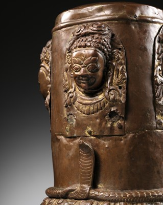 Lot 65 - A RARE COPPER REPOUSSÉ CHATURMUKHA-LINGA COVER, NEPAL, 16TH - 17TH CENTURY