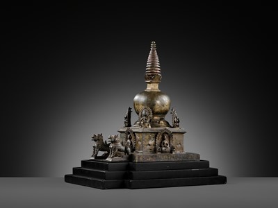 Lot 112 - AN IMPORTANT INSCRIBED BRONZE STUPA WITH FIVE DIRECTIONAL BUDDHAS, FOUR TARAS, GUARDIAN LIONS AND SNAKE CANOPY, 17TH-18TH CENTURY