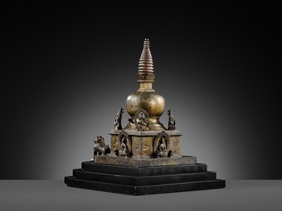 Lot 112 - AN IMPORTANT INSCRIBED BRONZE STUPA WITH FIVE DIRECTIONAL BUDDHAS, FOUR TARAS, GUARDIAN LIONS AND SNAKE CANOPY, 17TH-18TH CENTURY