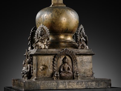 Lot 112 - AN IMPORTANT INSCRIBED BRONZE STUPA WITH FIVE DIRECTIONAL BUDDHAS, FOUR TARAS, GUARDIAN LIONS AND SNAKE CANOPY, 17TH-18TH CENTURY