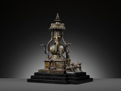 Lot 112 - AN IMPORTANT INSCRIBED BRONZE STUPA WITH FIVE DIRECTIONAL BUDDHAS, FOUR TARAS, GUARDIAN LIONS AND SNAKE CANOPY, 17TH-18TH CENTURY