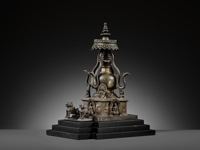 Lot 112 - AN IMPORTANT INSCRIBED BRONZE STUPA WITH FIVE DIRECTIONAL BUDDHAS, FOUR TARAS, GUARDIAN LIONS AND SNAKE CANOPY, 17TH-18TH CENTURY