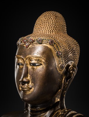 Lot 21 - A RARE AND LARGE GILT-LACQUERED BRONZE BUST OF BUDDHA, EARLY MANDALAY PERIOD