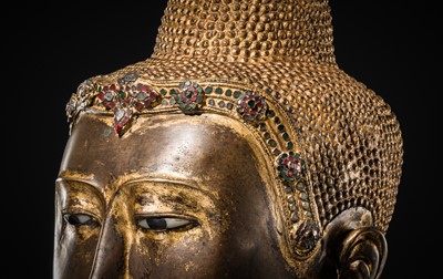 Lot 21 - A RARE AND LARGE GILT-LACQUERED BRONZE BUST OF BUDDHA, EARLY MANDALAY PERIOD