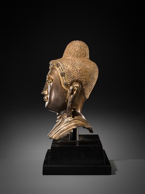 Lot 21 - A RARE AND LARGE GILT-LACQUERED BRONZE BUST OF BUDDHA, EARLY MANDALAY PERIOD