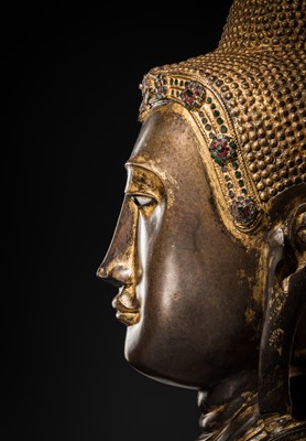 Lot 21 - A RARE AND LARGE GILT-LACQUERED BRONZE BUST OF BUDDHA, EARLY MANDALAY PERIOD