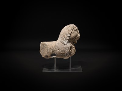 Lot 59 - A GRAY SCHIST CARVING OF A BUDDHIST LION, KUSHAN PERIOD