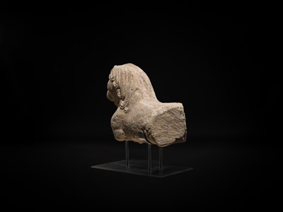 Lot 59 - A GRAY SCHIST CARVING OF A BUDDHIST LION, KUSHAN PERIOD