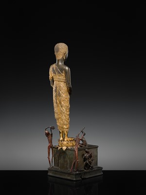 Lot 31 - A LARGE PARCEL-GILT-LACQUERED BRONZE GROUP DEPICTING PHRA MALAI IN HELL, RATTANAKOSIN PERIOD