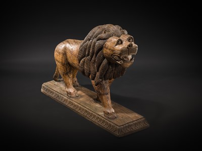 Lot 102 - A LARGE WOOD FIGURE OF A LION, SOUTH INDIA, PROBABLY TAMIL NADU, 19TH-20TH CENTURY