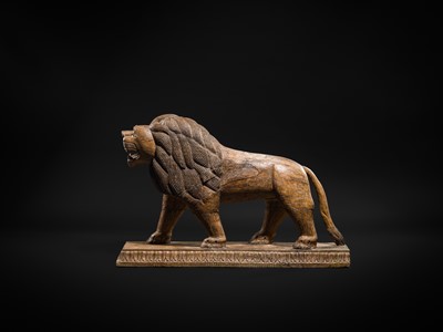 Lot 102 - A LARGE WOOD FIGURE OF A LION, SOUTH INDIA, PROBABLY TAMIL NADU, 19TH-20TH CENTURY
