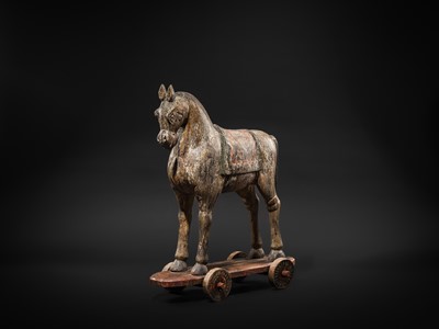 Lot 101 - A RARE AND LARGE POLYCHROME WOOD PULL-TOY HORSE