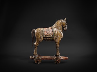 Lot 101 - A RARE AND LARGE POLYCHROME WOOD PULL-TOY HORSE