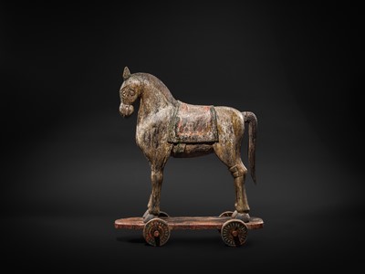 Lot 101 - A RARE AND LARGE POLYCHROME WOOD PULL-TOY HORSE